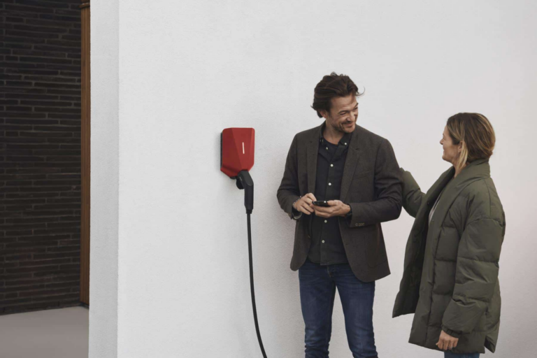 Couple charging on app from red home charger